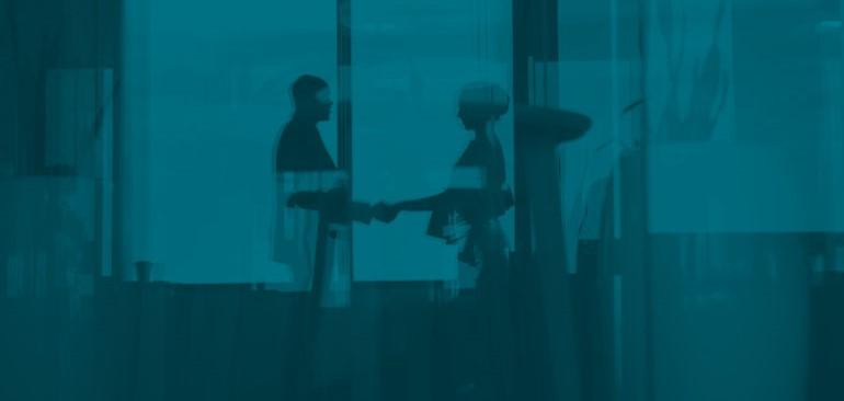 two people shaking hands with a very dark blue filter