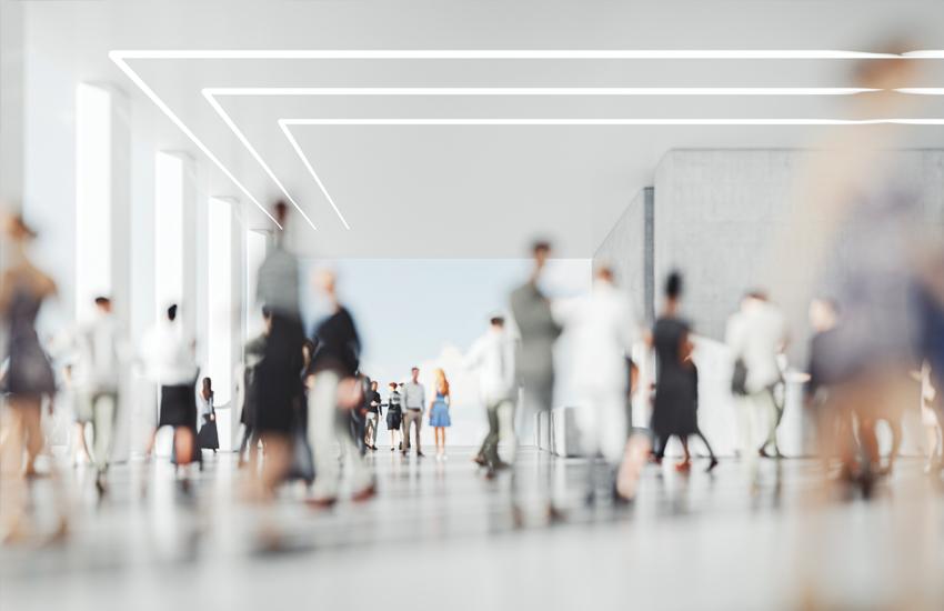 people walking in a hallway