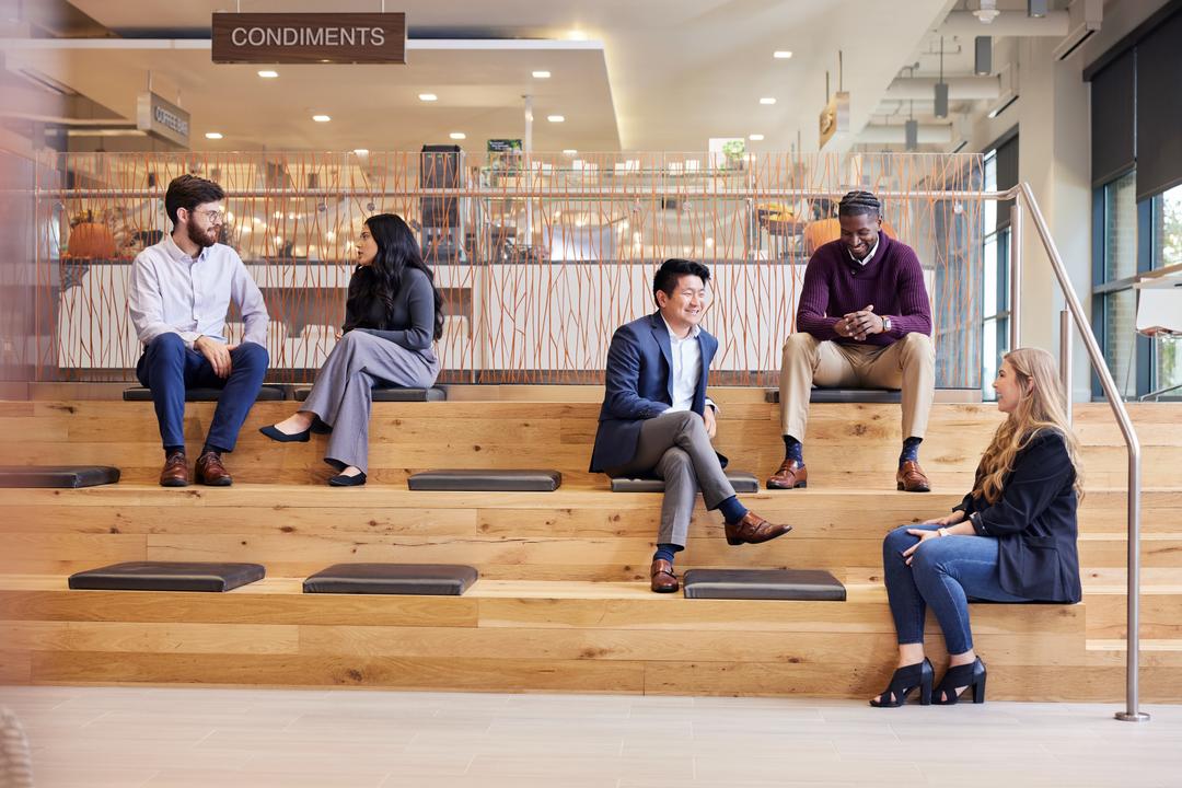 People speaking on benches