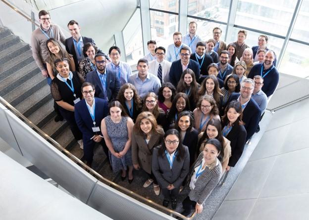 Sidley employees posing for a photo in the stairwell