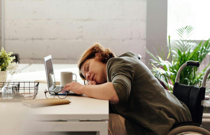 woman asleep at laptop
